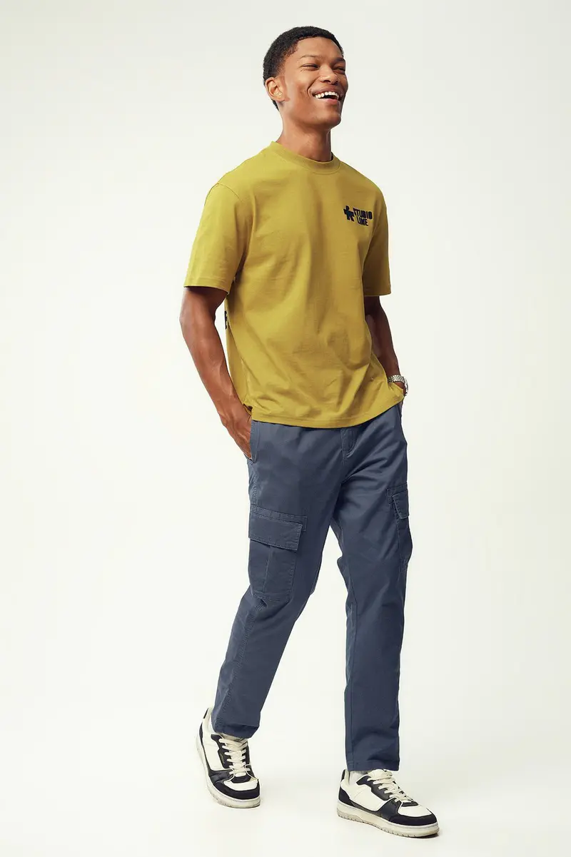 Calças Tapered em algodão · Homem · Azul
