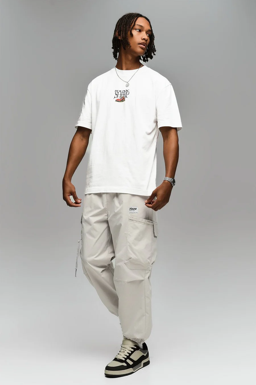 Calças jogger em poliéster · Homem · Creme