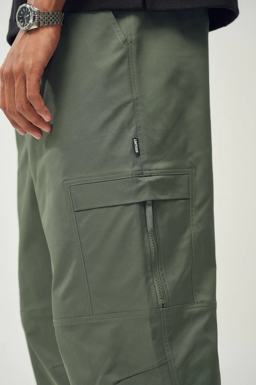 Calças jogger em poliéster · Homem · Verde Oliveira